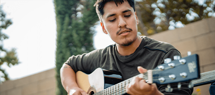 Hemophilia A patient, Daniel Cruz, playing guitar